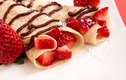 Close up image, tasty strawberry and chocolate crepes. 