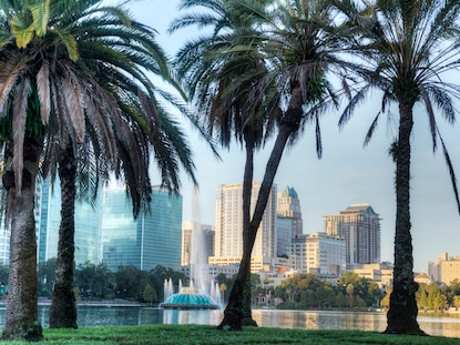 Palm trees and Fountain at Lake Eola Park, Orlando, Florida. 