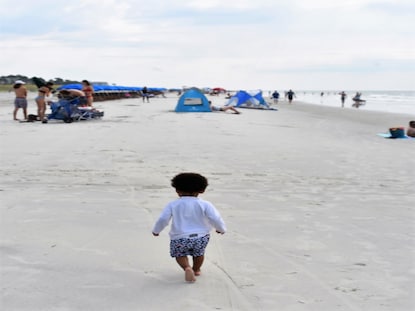 Toddler walking on Hilton Head Beach, South Carolina