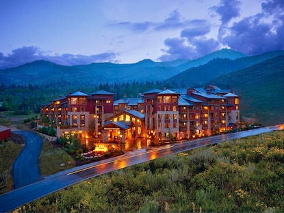 Sunrise Lodge, a Hilton Grand Vacations Club in Park City, Utah a glow on a summer night. 