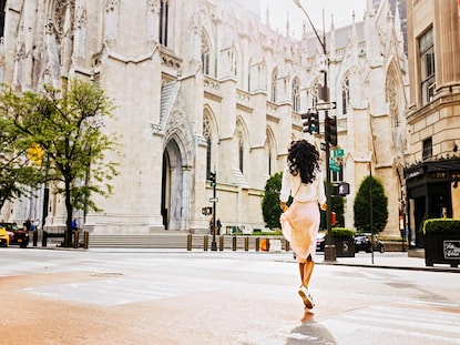 Woman running excitedly in New York City. 