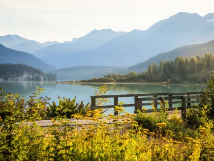 A trail and bridge by Green Lake in Whistler, Canada