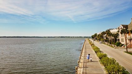 Aerial shot, woman walking, the Battery, Charleston, South Carolina. 