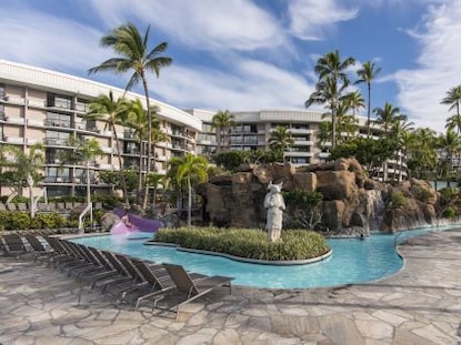 Pool and palm trees at Ocean Tower, a Hilton Grand Vacations Club on Big Island, Hawaii