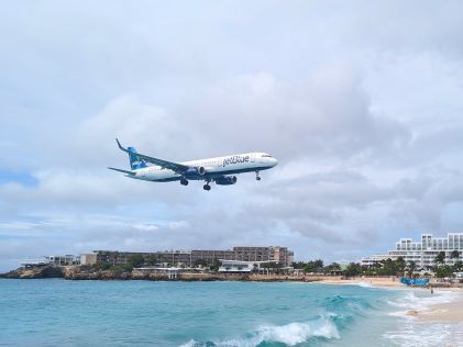 An airplane landing overhead Maho Beach on Sint Maarten
