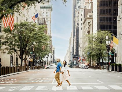 A couple crossing a street in New York City