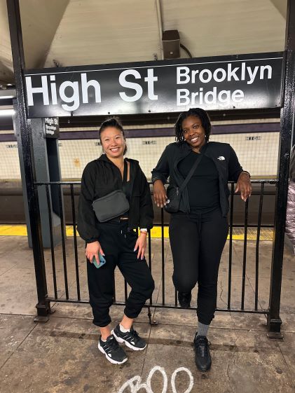 A Hilton Grand Vacations Member and friend in a subway station in New York