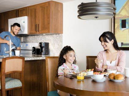 A family enjoys breakfast in their Suite at Royal Palm, a Hilton Vacation Club in Sint Maarten, Caribbean