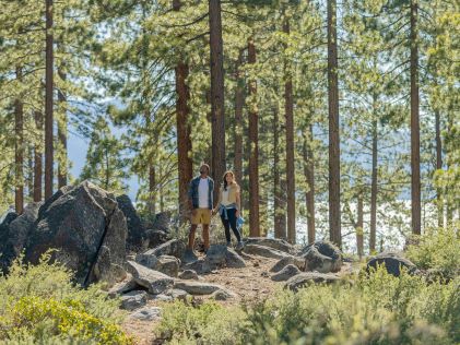 Two hikers in a forest near South Lake Tahoe, California