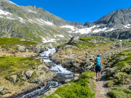 A hiker ascending the Alps near Schladming, Austria