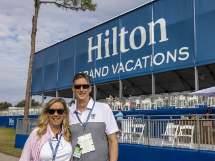 Hilton Grand Vacations Member Laurie and her partner enjoying their membership at the Hilton Grand Vacations Tournament of Champions