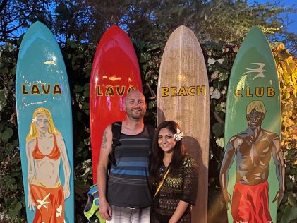 A Hilton Grand Vacations Member and her husband pose at a bar on the Big Island of Hawaii