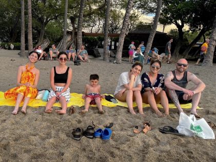 A Hilton Grand Vacations Member and her family on one of Big Island's public beaches